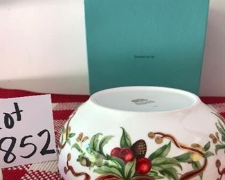Lot 852. $150.00.  Tiffany Holiday  Bowl(7.5"*3.25"h), covered trinket dish (3.5dia x 2 h) and Tiffany box. Both have a garland design. 