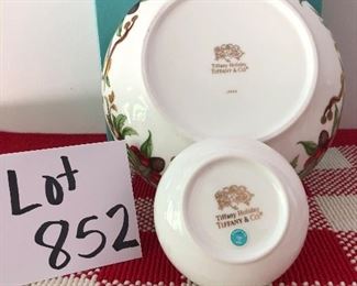 Lot 852. $150.00.  Tiffany Holiday  Bowl(7.5"*3.25"h), covered trinket dish (3.5dia x 2 h) and Tiffany box. Both have a garland design. 