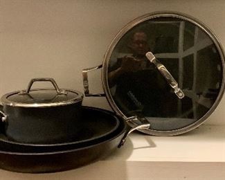 Lot of assorted Calphalon pans - two fry pans without lids, one saute/fry with lid and small sauce with lid: $40