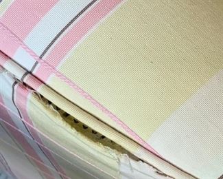 There is a split, a couple inches long, where the fabric meets the piping - nothing ripped - just a simple repair.