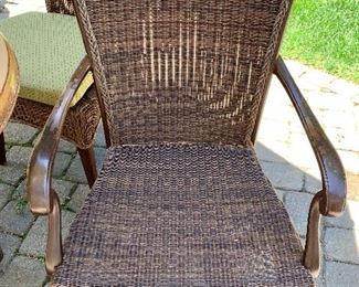 The two arm chairs are all-weather resin wicker and cast aluminum - there is some paint loss to the cast aluminum