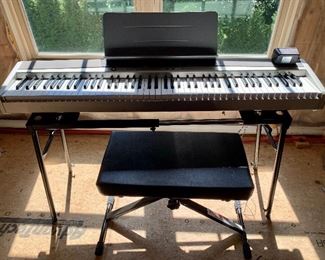 Item 150:  Privia 120 keyboard, stand and bench                                                                Piano - 52" : $245