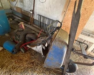 Wheel barrel, lawn mower, antique cultivator, more