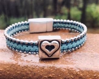 This turquoise blue and silver beaded leather bracelet has a square heart charm with a strong magnetic clasp. For only 32.  It can be made in a size 6-8 inches.  Shipping and curbside available.  DesignsbyJeffJewelry@gmail.com 815.519.7653