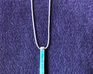 This beautiful created opal blue on one side and brown on other pendant comes on a 925 liquid silver necklace.  It is absolutely stunning!  People always say it is on of their favorite pieces.   $45