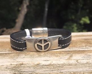 This peace charm on leather bracelet with a strong magnetic clasp bracelet can be made from a 6-8 inch wrist.  Only 32.  Many people love to buy this one as a gift for people who love the peace symbol.  