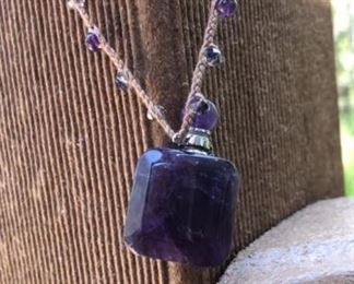 $36 Amethyst Perfume bottle with handmade macrame crystal necklace.  Comes with vial to put your favorite essential oil inside.  This is seriously cool!  I use orange oil in mine and find it Devine!