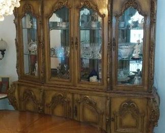Fine, Elegant, Carved Wood and Lighted China Cabinet, by the Finest Cellini Furniture Company, of Brooklyn, New York.  Vintage Hollywood Regency Style.
Asking only $1,200. obo.).  Was over $3,200. when new.  Also by the Cellini Furniture Company.
