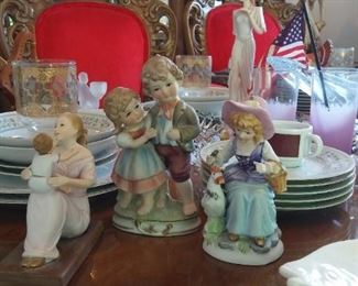 Three 3 more Ceramic Figurines, one is a marked Capodimonte Collectors Piece. At center.
