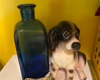 Old blue bottle, ceramic dog