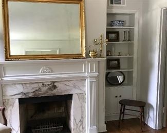 Mirror and decorative items on bookcases