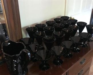 Black glass pitcher and glasses. Rare!