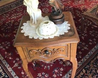 Carved accent table with drawer