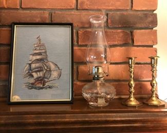 Ship needlepoint, oil lamp and candleticks