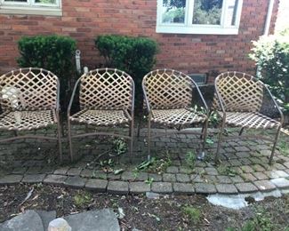 Four mid century Brown Jordan  outdoor club chairs