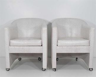 Pair of Preview side chairs on casters in faux ostrich. $800 pair. 