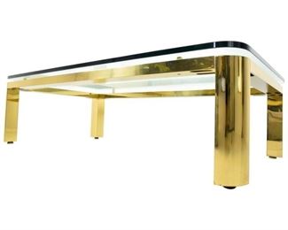 Mastercraft style cocktail table in brass with thick glass top.  $475