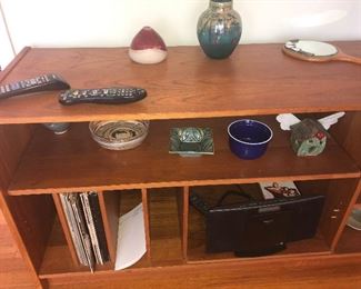 NICE COLLECTION OF SIGNED POTTERY PIECES THIS LONG TABLE BOOKSHELF IS SOLD
