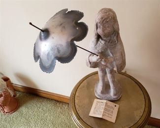  Stone girl with metal umbrella by the artist Klara Sever