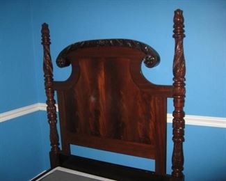 detail of twin headboard and carved posts