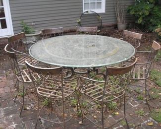 Patio table with heavy metal base, glass top and 8 chairs