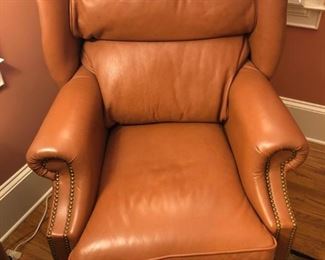 $365 - Leather Center tan leather wingback chair with studded arms. Extremely comfortable!