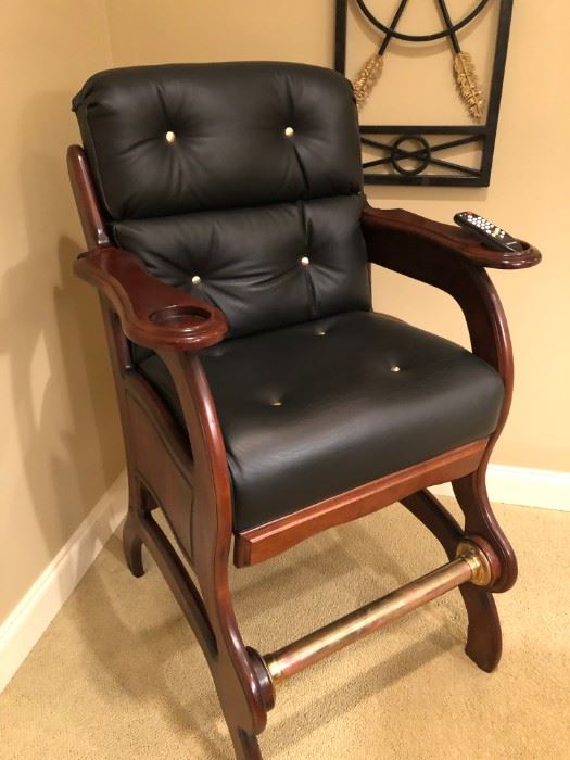 $425 - Leather studded pool room chair with brass foot rail. Great for his "man cave."