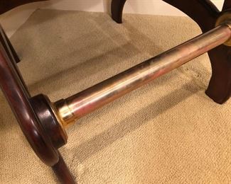 $425 - Brass foot rail that accents the leather studded pool room chair. Great for his "man cave."