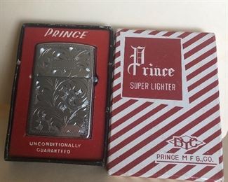 Lot 75B, Vintage Prince lighter in box, $14