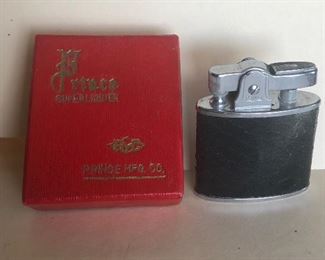 Lot 77B, Vintage Prince lighter in box, $14