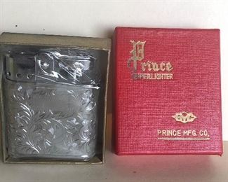 Lot 78B, Vintage Prince lighter in box, $18