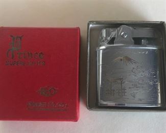 Lot 79B, Vintage Prince lighter, Asian carved, $18