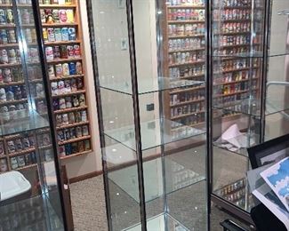 Glass Display Cases, there are three of them. There is one key for all three of them. They are being sold as a set. $450.00 for the three