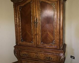 Bedroom Set: Armoire, King Size Bed (see photo of missing trim where pillows sit), Dresser with marble top and mirror, two nightstands with marble tops: $2,800.00