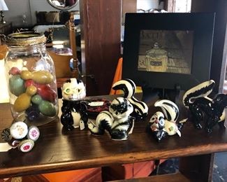 Vintage Ceramic and Porcelain Small Skunks and a Jar of Small Wooden Bowling Pins