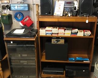 Stereo Equipment, Speakers, 8-Track Tapes, Vintage Desk Clocks, and Glass Front Stereo Cabinet