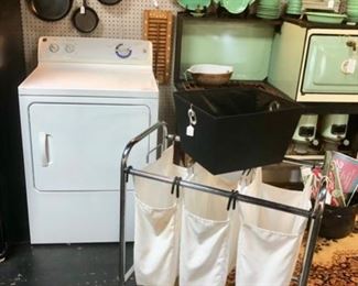 GE SIGNAL FABRIC CARE Dryer in very good condition and it works and a 3-part laundry rolling container