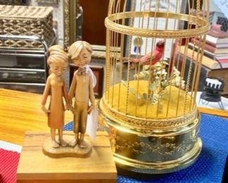 "REUGE" (c.1900-1940), Sainte Croix, Switzerland, Hand Crafter, Gold Plated, "Singing" and Moving Bird in a Cage Music Box (valued $1,800-$4,800), and a smaller, wooden "REUGE Summer Wind" Music Box (valued at $125). These are true pieces of art and extremely collectible.