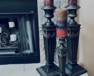 Tall fireplace candle sticks.