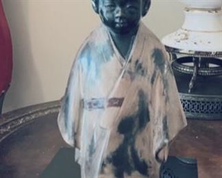 Asian boy figure.