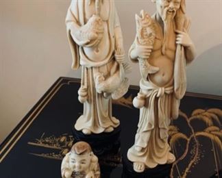 3 Asian carved figures.