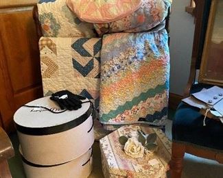 Nice old quilts and hat boxes