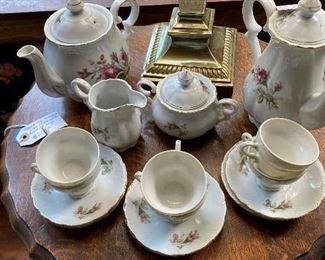 Occasional table with pie crust type top and china tea set