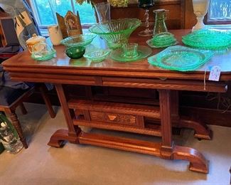Wonderful antique side table with display of depression glass