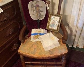 Bedroom chair with antique fan and linens