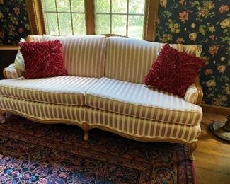 Clean striped upholstered divan with fun pillows