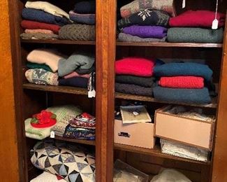 Nice selection of sweaters, vintage purses, and vintage bridal dress