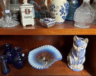Blue opalescent fluted bowl and porcelain blue and white kitty figurine