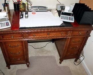 #44 - Office Desk Lot - includes wood desk, table, rolling chair, chair mat, lamps, paper shredder, desk accessories, and office supplies