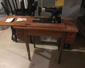 Awesome vintage Singer sewing machine with stand. Still works!
